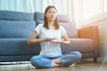 Fototapeta na wymiar yogi woman practicing yoga lesson, breathing, meditating, indoor close up. Well being, wellness concept