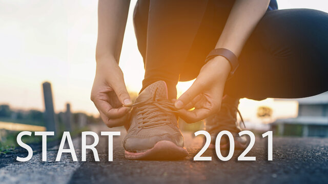 2021 The Start Into The New Year.sports Background. Legs Of Runner Feet Running On Road