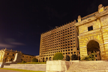 Destroyed government building against the background of a clear night sky