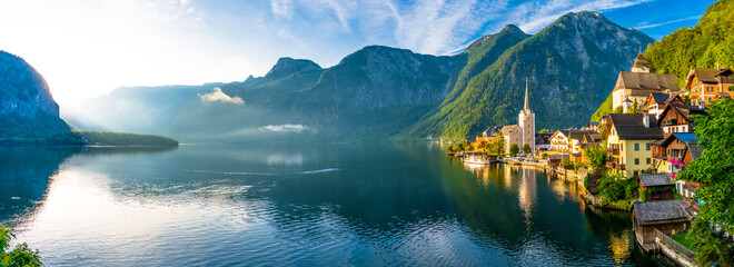 Scenic picture-postcard view of famous Hallstatt mountain village in the Austrian Alps at beautiful...