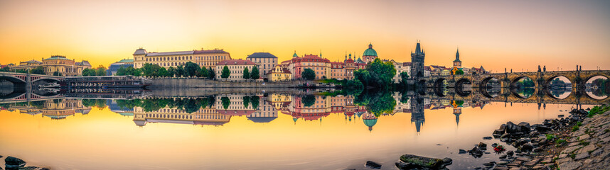 Sunrise panorama of Prague including Old town tower and Charles and Manes bridges