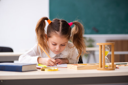 Small girl in time management concept