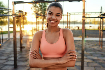 Portrait of young mixed race girl in sport ground