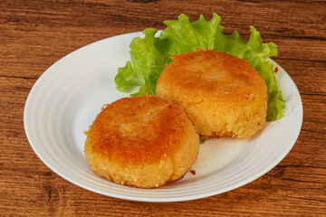 Vegan cuisine - Potato cutlet in the plate