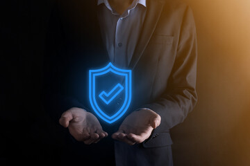 Protection network security computer in the hands of a businessman. business, technology, cyber security and internet concept - businessman pressing shield button on virtual screens Data protection
