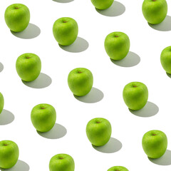 Trendy sunlight summer pattern of the green apple. Minimal summer concept. Square size of photo.