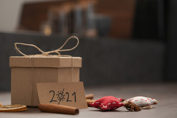 Christmas gift box from eco friendly paper wrapped with natural twine on wood table with natural...
