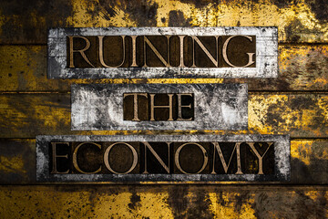 Ruining The Economy text on vintage textured bronze grunge copper and gold background