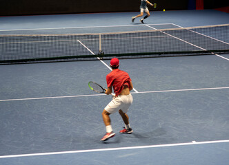 tennis player on the tennis court in motion.