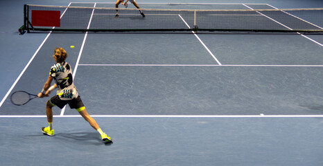 Fototapeta na wymiar tennis player on the tennis court in motion.