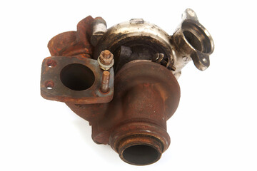 Havily used rusty and carbonized turbocharger on background