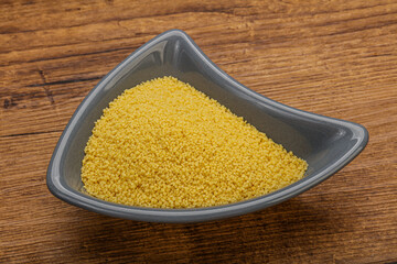 Raw cous cous heap in the bowl