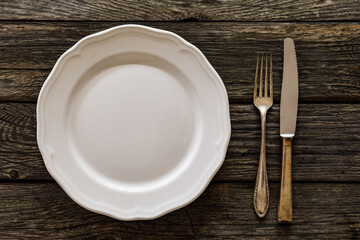 Empty plate on wooden table 