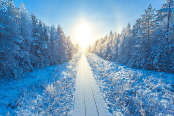 Snowy winter railroad view. First snow sunset landscape. Photo from Sotkamo, Finland.	