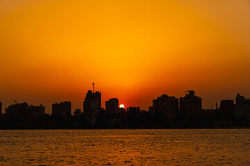 Sunset on the skyline of the city of Cairo, the sun goes down on the buildings of the city of Cairo in the background. Africa