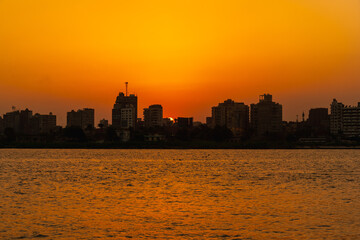 Sunset on the skyline of the city of Cairo, the sun goes down on the buildings of the city of Cairo in the background. Africa