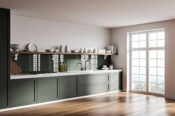 White and green kitchen corner with cupboards
