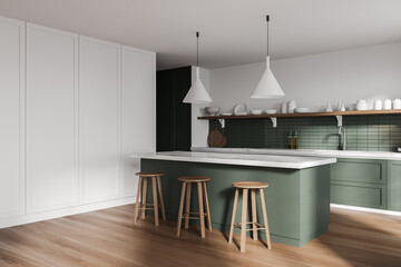 White and green kitchen corner with bar and stools