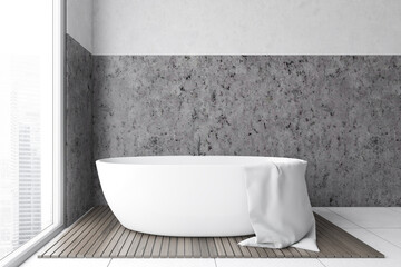 Fototapeta na wymiar Grey marble bathroom with white bathtub on wooden rug near big window