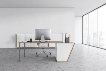 White office room with chair, table and computer on marble floor near window