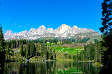 Italy, South Tyrol, Karersee - 5 September 2020 - The Rosengarten in the background of the Karersee