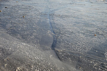 ice of a beautiful and unusual shape on a frozen pond in Moscow in winter