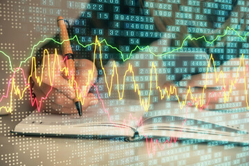 Double exposure of businesswoman hands typing on computer and forex graph hologram drawing....