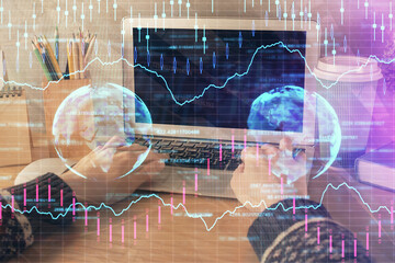 Double exposure of woman hands typing on computer and forex chart hologram drawing. Stock market invest concept.