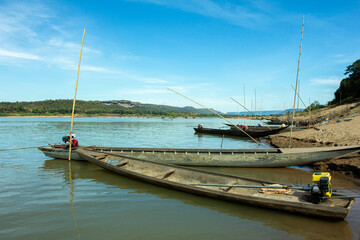Many boats parked at the riverside at the strange market, Laos.