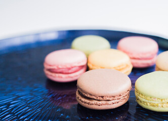 colorful macaroons on wooden background