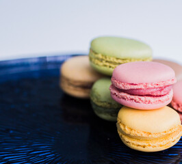 colorful macaroons on a wooden table