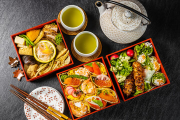 Fototapeta na wymiar 折詰弁当　Typical Japanese lunch box (bento) set