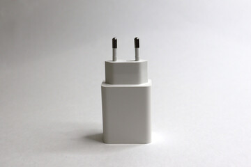 charger and usb cable for phone on white background