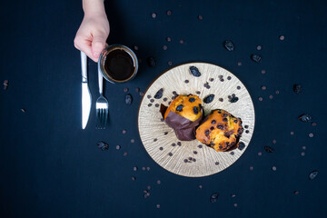 Chocolate muffin, coffee and chocolate chips