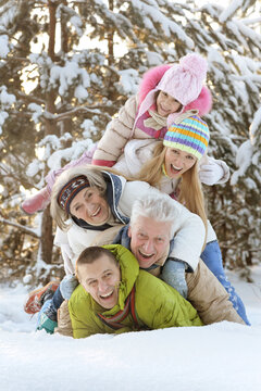 Big Happy Family Having Fun In Winter Park Covered With Snow