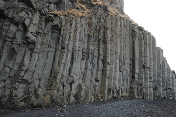 The rocks of the beach Reynisfjara in the south of Iceland.