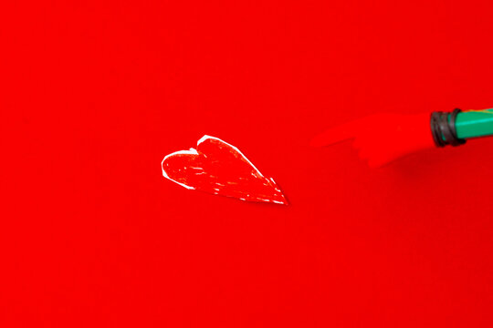 Red heart made of paper on a red background. Love, Valentine's day concept.