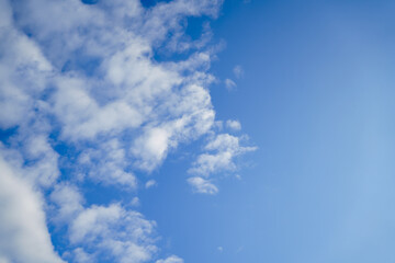 Naklejka na ściany i meble daytime blue sky with white clouds. Weather forecast. 