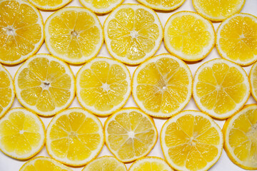 Fototapeta premium Abstract photo of a yellow lemon fruit, top down.