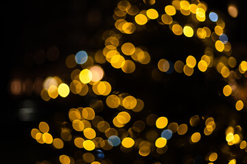 Christmas Background. Golden Holiday Abstract Glitter Defocused Background. Blurred Bokeh