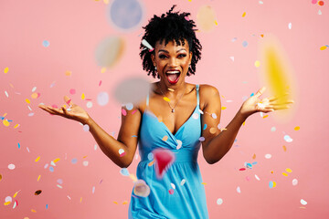 Portrait of a happy, excited young woman celebrating fun birthday or new year with colorful party...