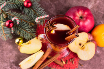 Christmas mulled wine with apples and citrus fruits and spices.
View from above.