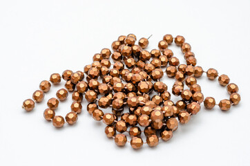 String of gold beads for the neck on a white background