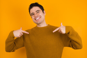 Pick me! Confident, self-assured and charismatic Young handsome Caucasian man wearing yellow...