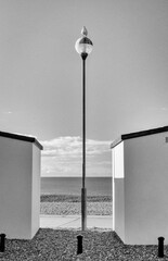 Street light between beach huts on the seafront