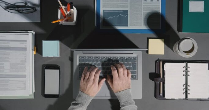 Corporate businessman working on a tidy desktop