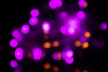 Bright Christmas blurred background with lilac colour garlands.