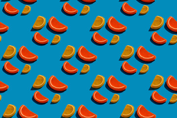 Seamless pattern of orange and lemon drops  on teal background