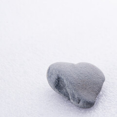 Fototapeta na wymiar Heart shaped natural stone with white background