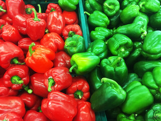 Obraz na płótnie Canvas Red, and green bell pepper capsicum displayed for sell in fresh market